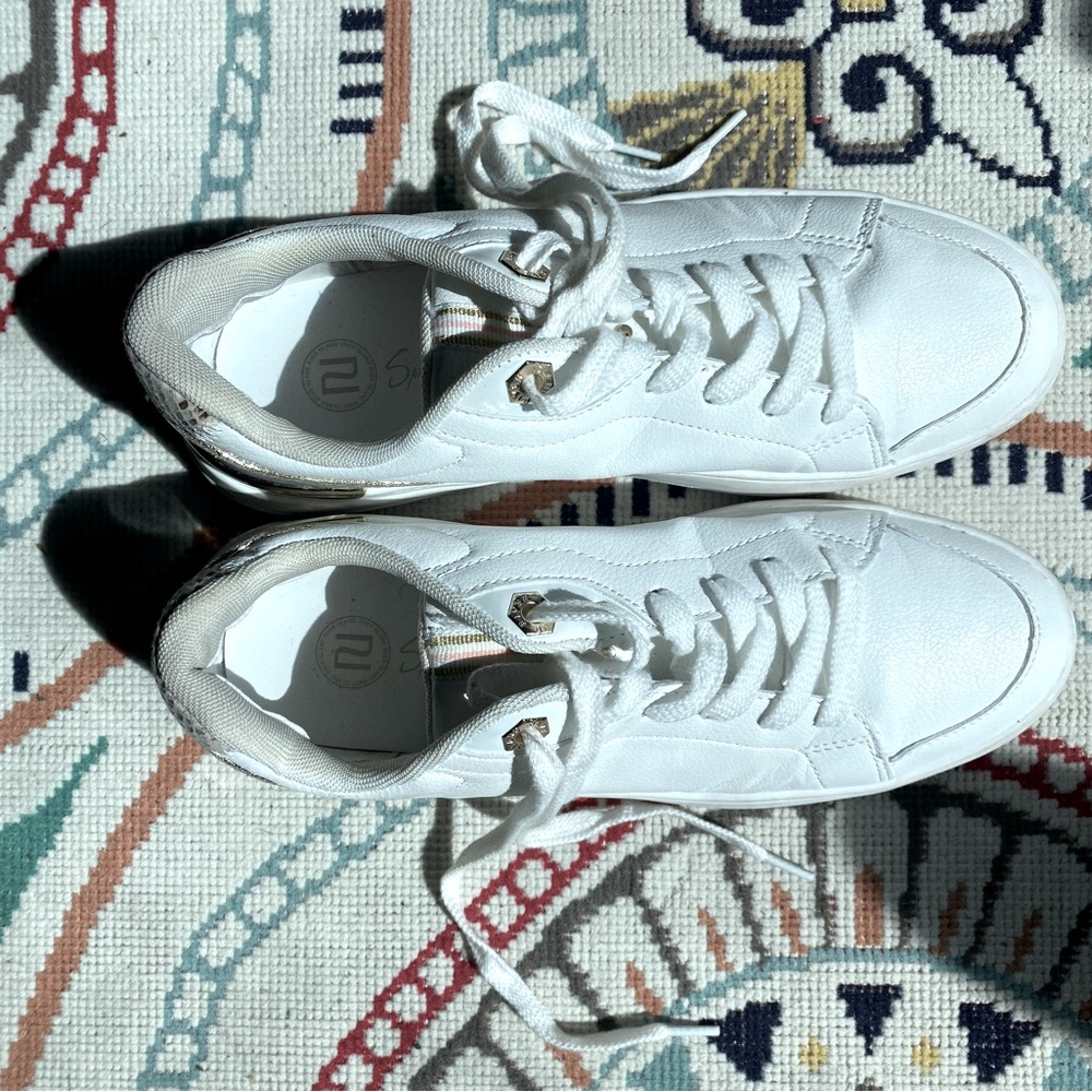 River Island lace up sneakers with gold and pink snake skin accent.